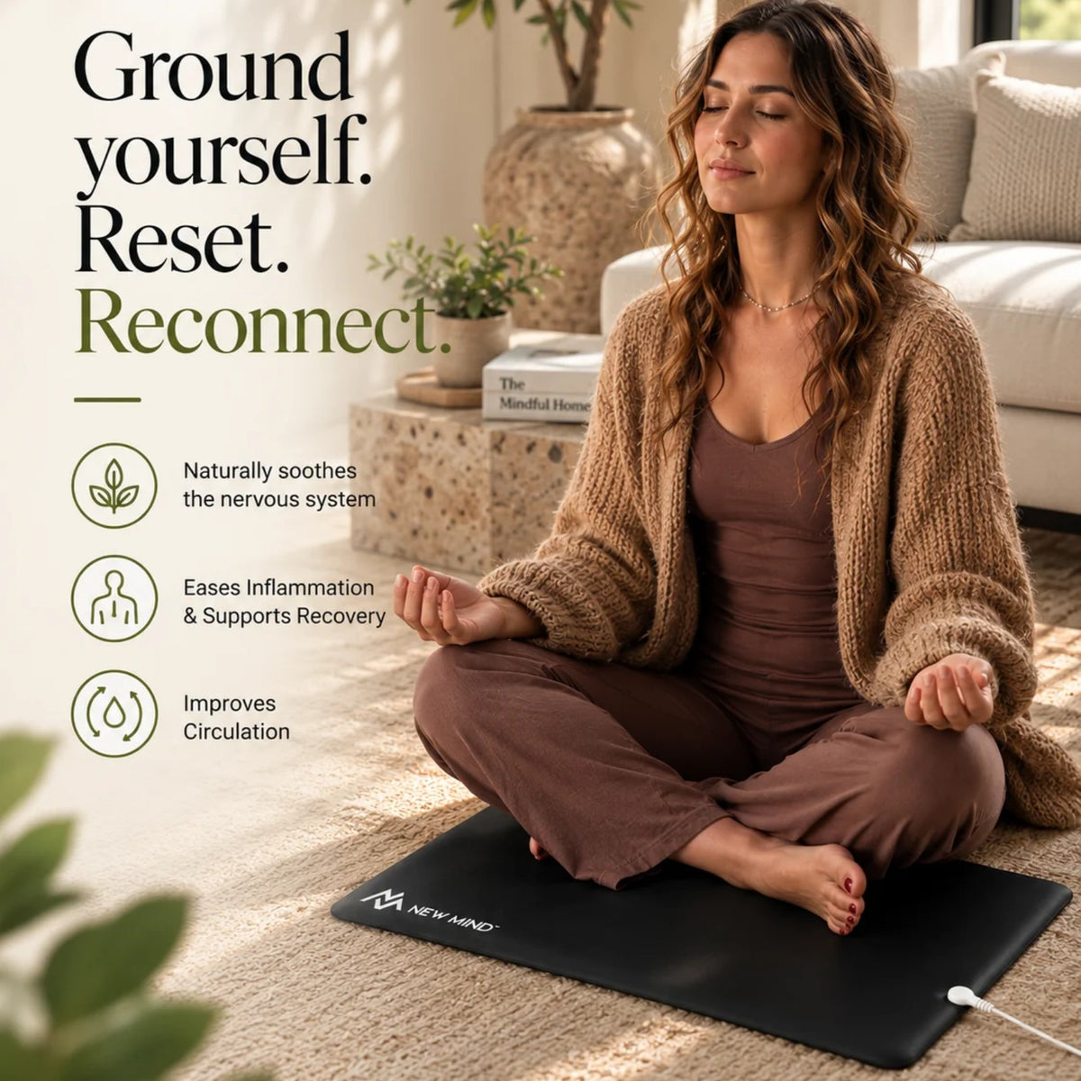 Woman meditating on the New Mind grounding mat: ground yourself, reset, reconnect