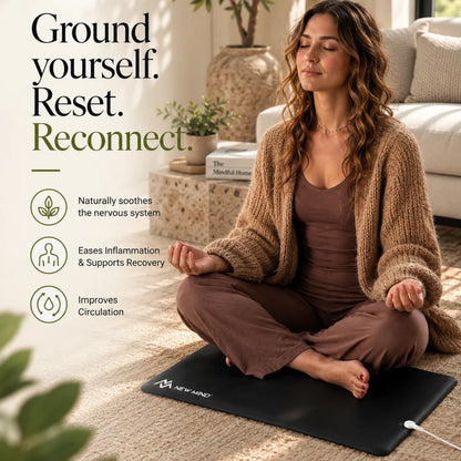 Woman meditating on the New Mind grounding mat: ground yourself, reset, reconnect
